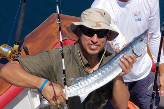 a man holding a fish