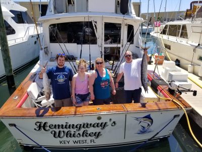 a group of people standing on a boat